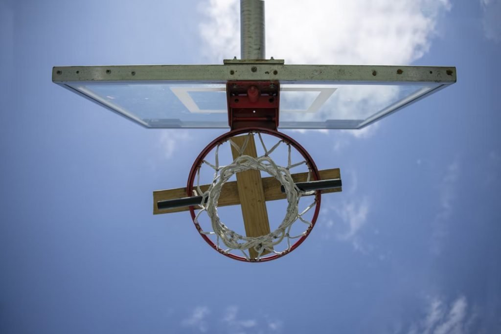 Image of Locked up basketball hoop on a playground court.