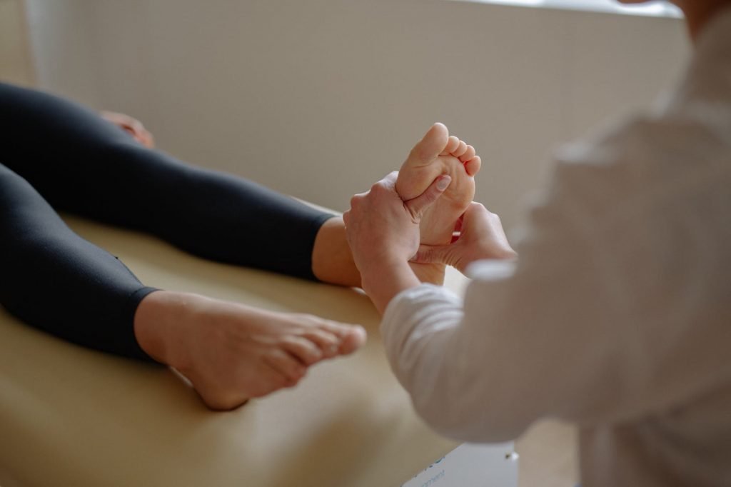 Image of A Person Massaging a Person's Foot