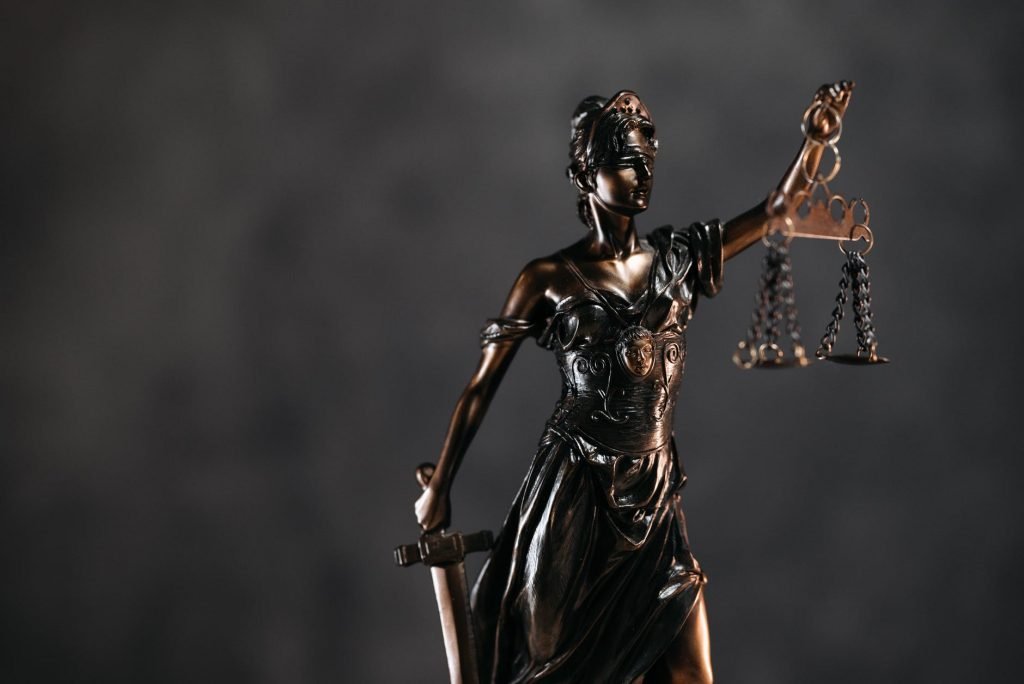 Image of Woman in Black Dress Holding Sword