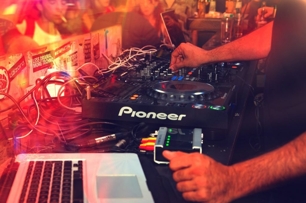 Image of Man Playing Pioneer Dj Turntable