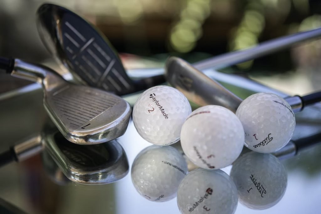 Image of Golf clubs and balls shot close up.