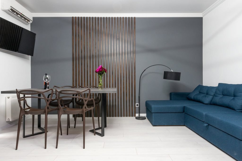 Image of Modern dining room interior with table and sofa at home