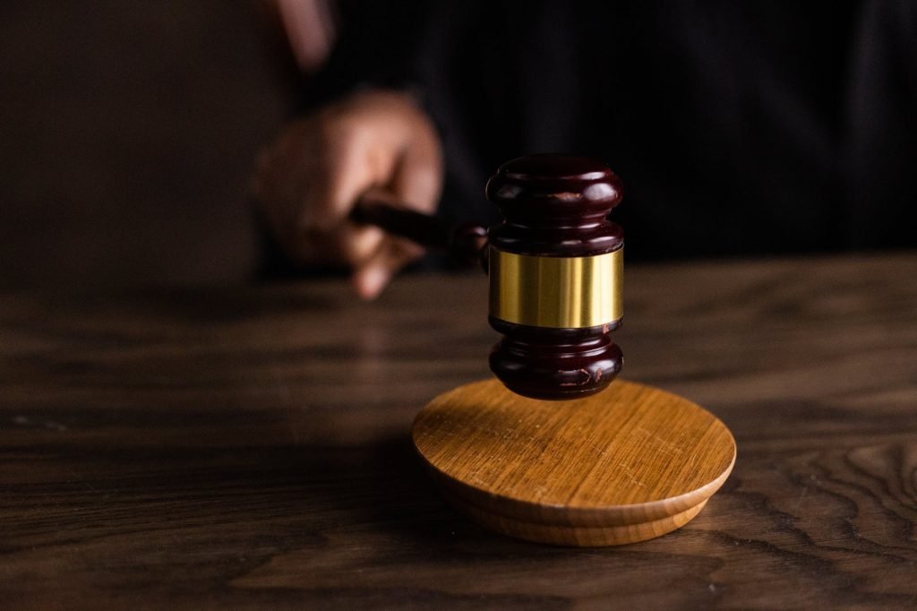 Image of Brown Wooden Gavel on Brown Wooden Table