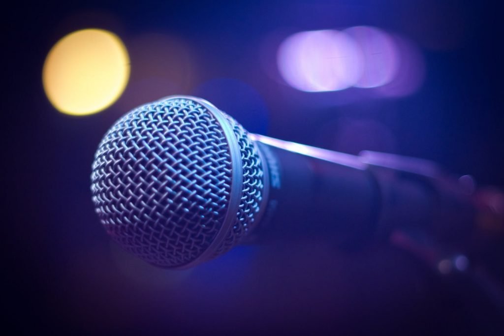 Image of Tilt Shift Photograph of Gray and Black Microphone