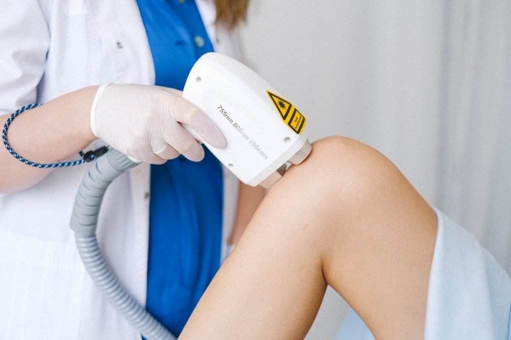 Image of Doctor in formal clothes doing low level laser therapy