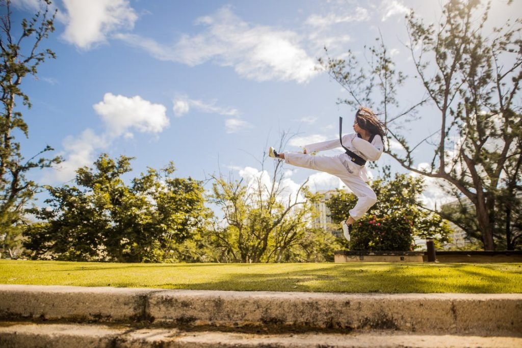 Image of Woman Wearing White Karati G Under Blue Sky