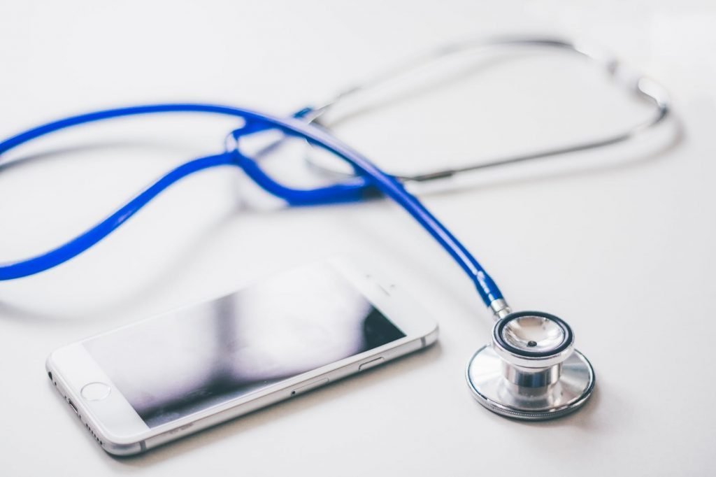 Image of Silver Iphone 6 Near Blue and Silver Stethoscope
