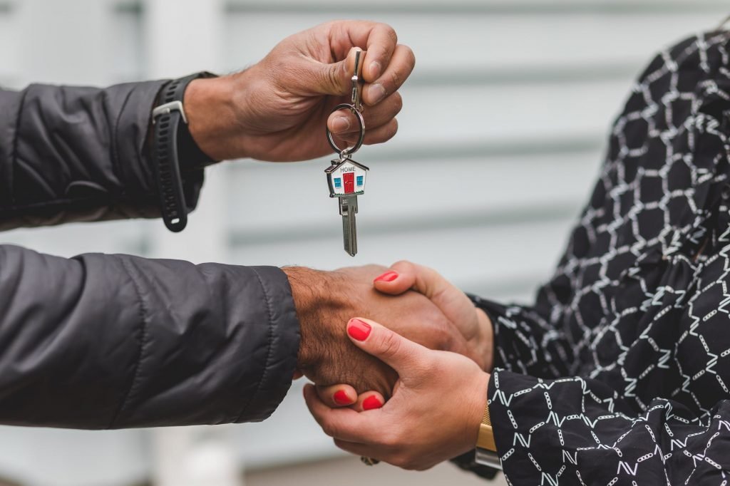 Image of Person Holding Silver Key