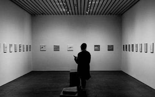 Image of Man Looking Inside An Art Gallery