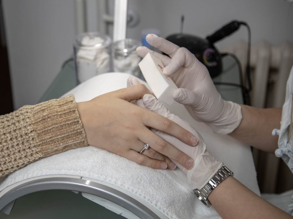 Image of Close-up of a Nail Technician Working on a Client