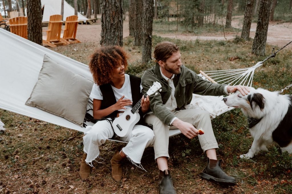Image of Photo of a Woman Playing the Ukulele Beside a Man