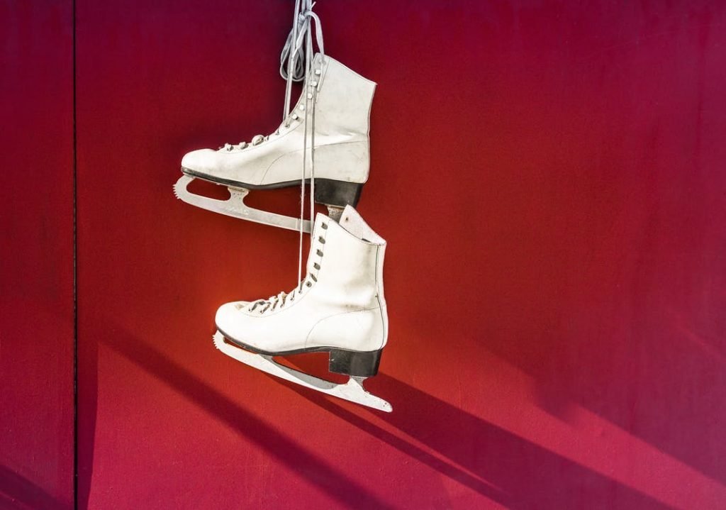 Image of Hanged Pair of White Leather Figure Skates