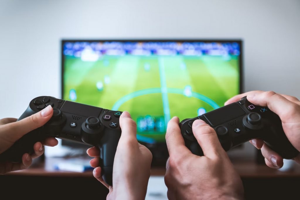 Image of Hands holding the game controllers