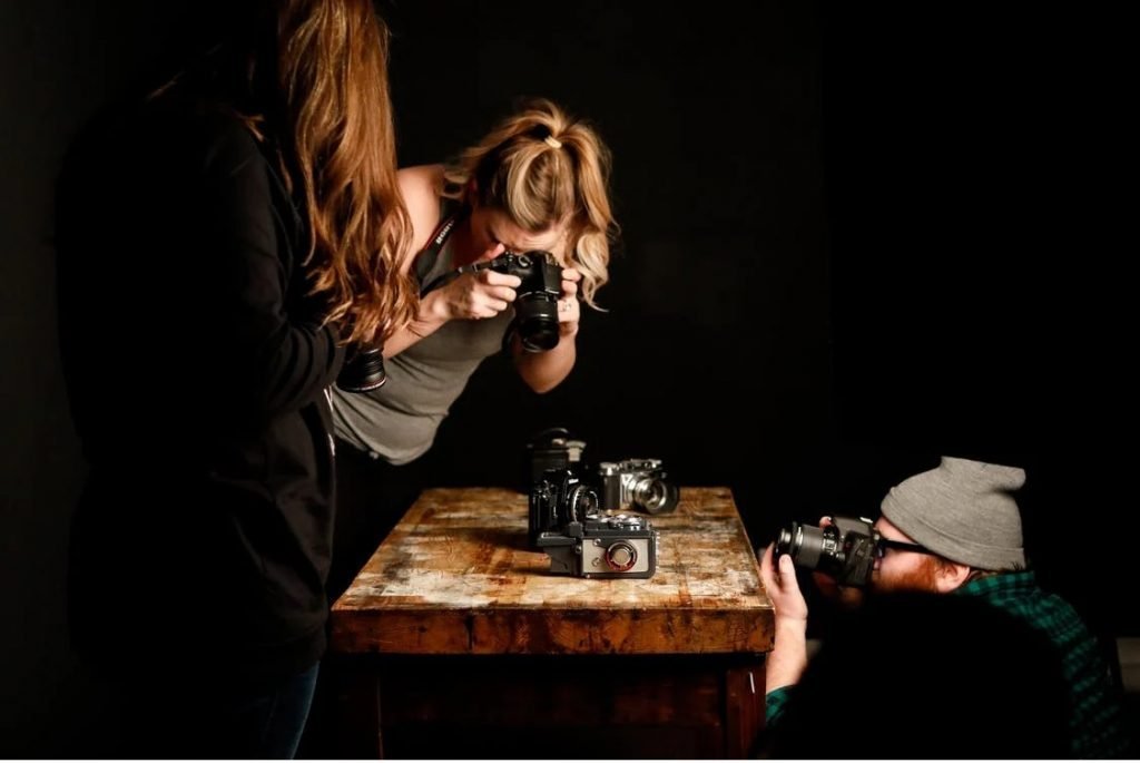 Image of People Taking Pictures of Vintage Cameras