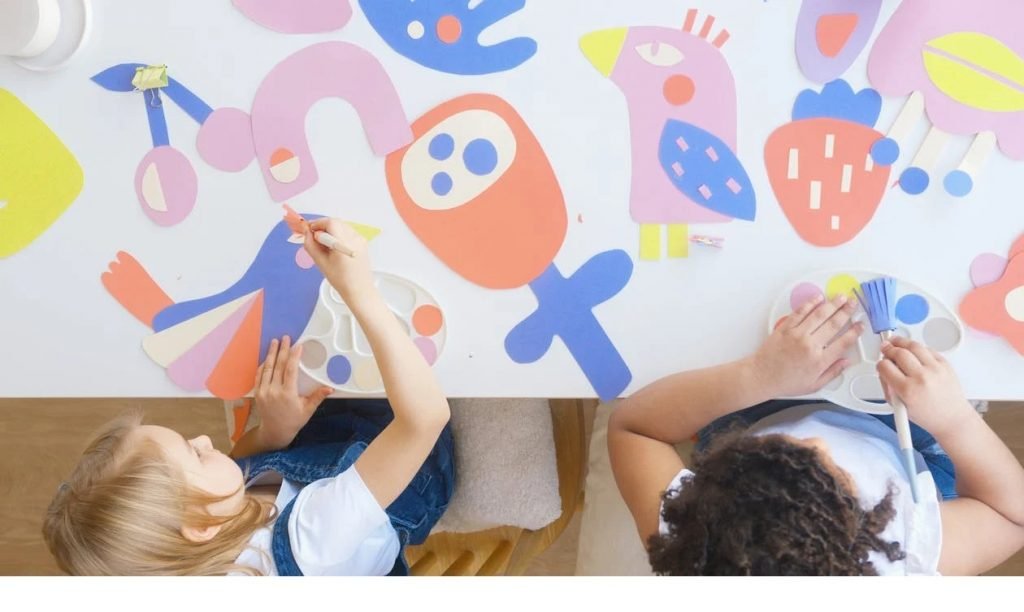 Image of two children painting